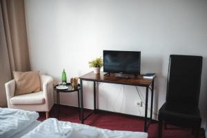 Televiisor ja/või meelelahutuskeskus majutusasutuses Wellness hotel Lucia
