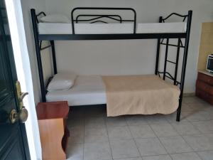 Postel nebo postele na pokoji v ubytování Estia Studios