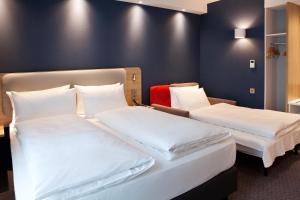 Postel nebo postele na pokoji v ubytování Holiday Inn Express Fürth by IHG