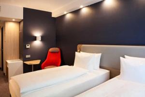 Postel nebo postele na pokoji v ubytování Holiday Inn Express Fürth by IHG
