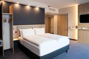 Postel nebo postele na pokoji v ubytování Holiday Inn Express Fürth by IHG