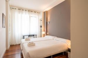 Postel nebo postele na pokoji v ubytování Ibarrola Apartment by People Rentals