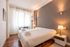 Postel nebo postele na pokoji v ubytování Ibarrola Apartment by People Rentals