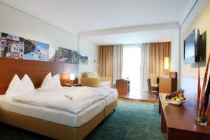 Postel nebo postele na pokoji v ubytování Seminarhotel Lengbachhof GmbH