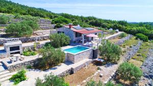 an aerial view of a house with a swimming pool at Holiday Home Zule in Žrnovo