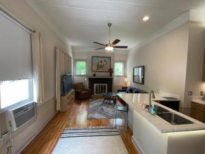 a kitchen and living room with a ceiling fan at 1322-#6 Downtown high ceiling big size 1B unit in San Antonio