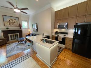 a kitchen with a refrigerator and a counter top at 1322-#6 Downtown high ceiling big size 1B unit in San Antonio