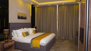 Ένα ή περισσότερα κρεβάτια σε δωμάτιο στο Clowzer Hotel Appartments