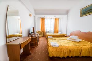 Postel nebo postele na pokoji v ubytování Hotel Atlantis + 15 fotografií