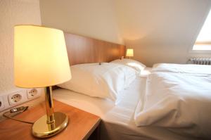 Ein Bett oder Betten in einem Zimmer der Unterkunft Hotel Wiking