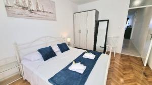 Posteľ alebo postele v izbe v ubytovaní Apartment Diocletian
