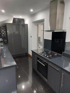 a large kitchen with a stove top oven at Riverside in York