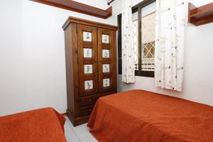 Ein Bett oder Betten in einem Zimmer der Unterkunft AT250 Con piscina, parking, wifi, playa a 150m