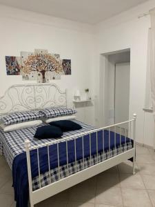 Postel nebo postele na pokoji v ubytování Ca' ToscaLina