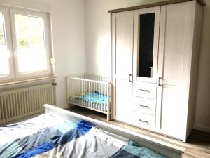 Postel nebo postele na pokoji v ubytování Ostfriesenleev