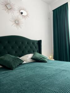 Cama o camas de una habitación en Royal Reed Apartments