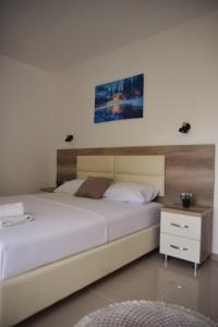 Postel nebo postele na pokoji v ubytování Apartments kupi ul rudaj 41