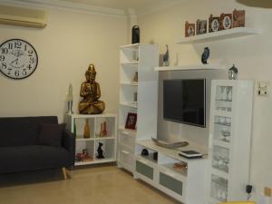 a living room with a tv and a couch at Dream Villa in Adeje