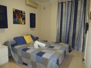 a bedroom with a bed with a plaid blanket at Dream Villa in Adeje +36 photos