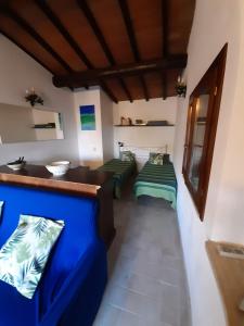 Кровать или кровати в номере Affitti Brevi Toscana - La Terrazza sulla Spiaggia