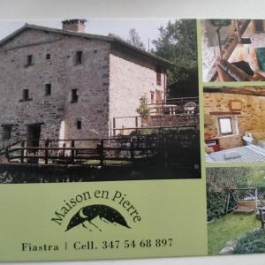 a collage of photos of a building with a sign at Maison en Pierre in Fiastra