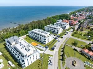 an aerial view of buildings in front of the ocean at Platinium Rewal Aparthotel 21,23 in Rewal
