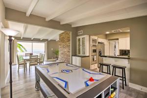 a kitchen and living room with a ping pong table at Stunning Palos Verdes Escape Pool, Fire Pit! in Rancho Palos Verdes