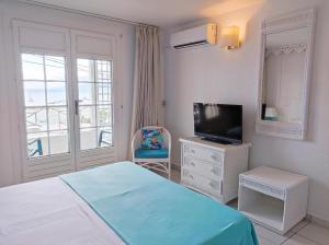 Кровать или кровати в номере Résidence Turquoise Guadeloupe - Vue mer et lagon