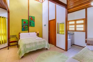 a bedroom with a bed in a room at Recanto Apoena in Santa Isabel