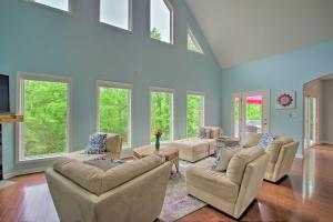 a large living room with couches and windows at Yogis Paradise with Deck about 1 Mi to Yogaville! in Buckingham