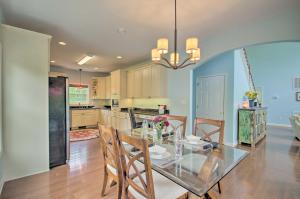 a dining room and kitchen with a glass table and chairs at Yogis Paradise with Deck about 1 Mi to Yogaville! in Buckingham