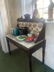 a table with bowls of food on top of it at 29 The Square in Listowel