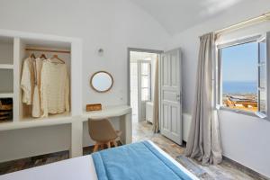 Postel nebo postele na pokoji v ubytování El Verano Suites