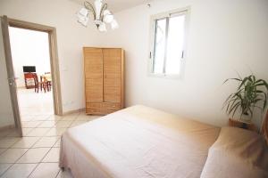 A bed or beds in a room at Casa Simone by RENTHOUSESALENTO Még 4 kép