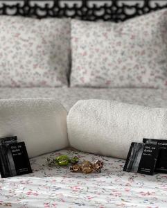 a bed with two books and a toy on a table at Casa Rural La Buhardilla in Benaocaz