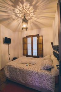 Кровать или кровати в номере Casa Rural La Buhardilla