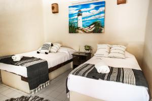 Postel nebo postele na pokoji v ubytování Hotel Macondo Holbox