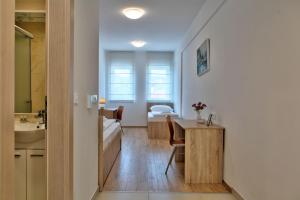 Postel nebo postele na pokoji v ubytování Hotel Dompes