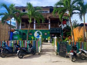 a group of motorcycles parked in front of a building at Chief Mau Moalboal Cebu in Moalboal