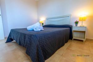 Łóżko lub łóżka w pokoju w obiekcie INMOWEAVER 22B ES Con preciosas vistas al mar