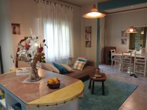 a living room with a couch and a table at casa Guanita in Santa Lucia