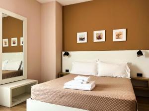 Postel nebo postele na pokoji v ubytování Oda Hotel Tirana