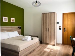 Postel nebo postele na pokoji v ubytování Oda Hotel Tirana