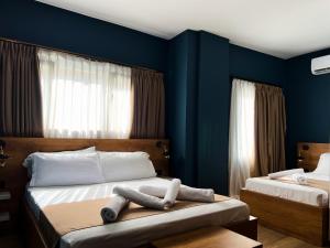 Postel nebo postele na pokoji v ubytování Oda Hotel Tirana