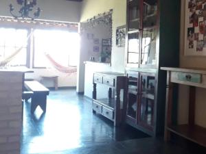a kitchen with a stove and a counter top at Poente Guest House in Conceição da Ibitipoca