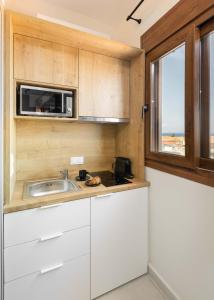 Kjøkken eller kjøkkenkrok på Palm Residences