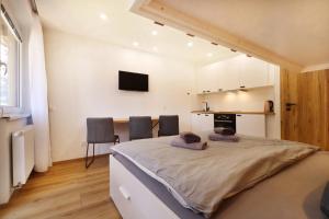 a bedroom with a large bed in a room at Appartements Eisenstein in Bayerisch Eisenstein