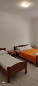 A bed or beds in a room at Becici rooms