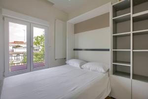 Säng eller sängar i ett rum på Apartamento Velazquez vistas