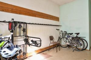 two bikes hanging on a wall in a room at Appartements Eisenstein in Bayerisch Eisenstein